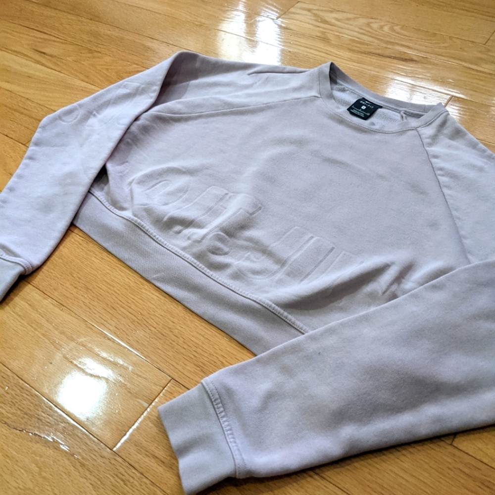Baby pink cropped Nike sweater